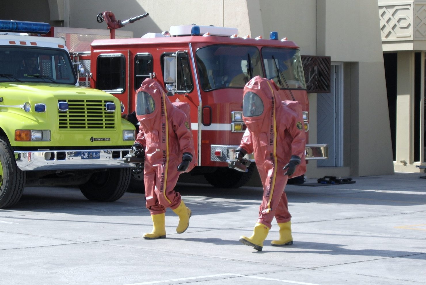 Two responders in gas-tight protective suits during a HazMat exercise